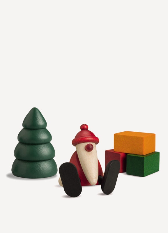 Miniaturset - Weihnachtsmann auf Kante sitzend mit Baum und Geschenken